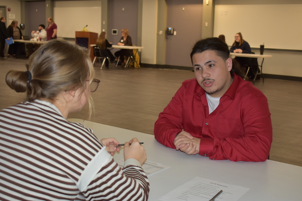 A student asking a question during na interview