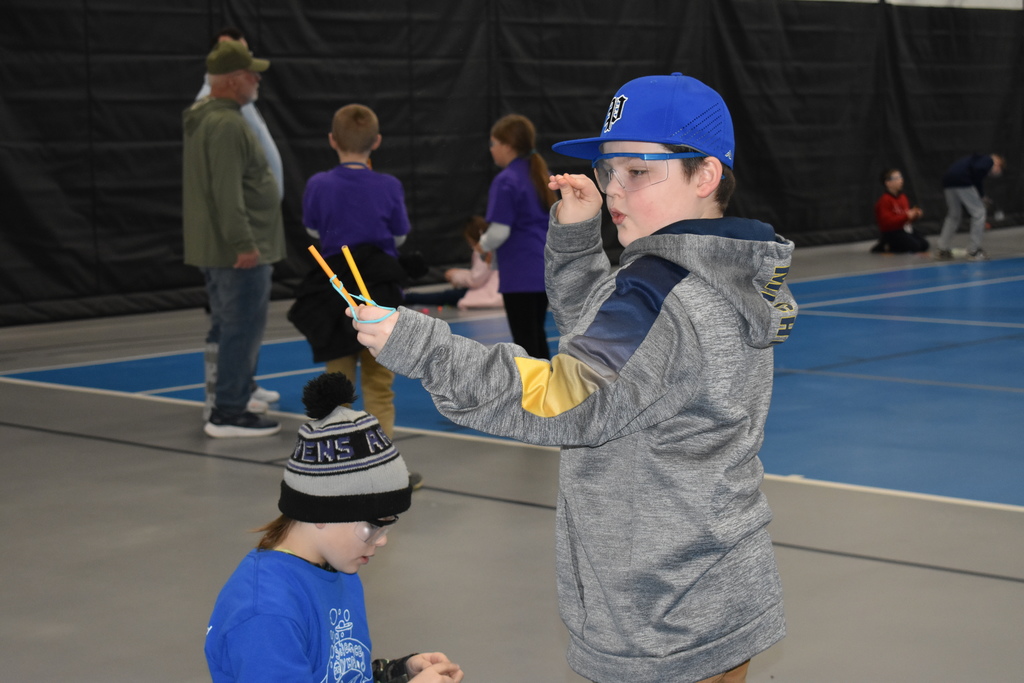 A student practicing his slingshot