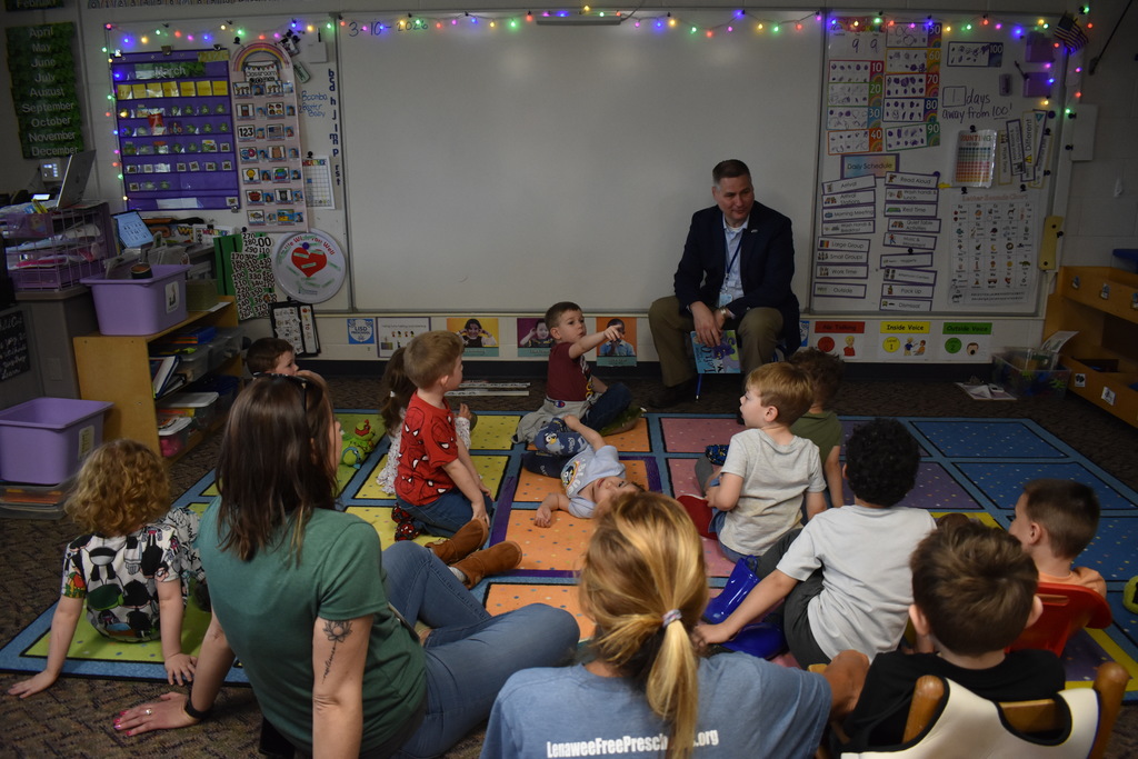 Students chatting with Mark Haag at the end of the book