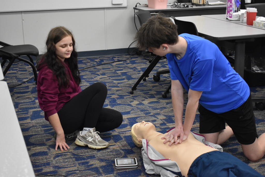 A student demonstrating CPR