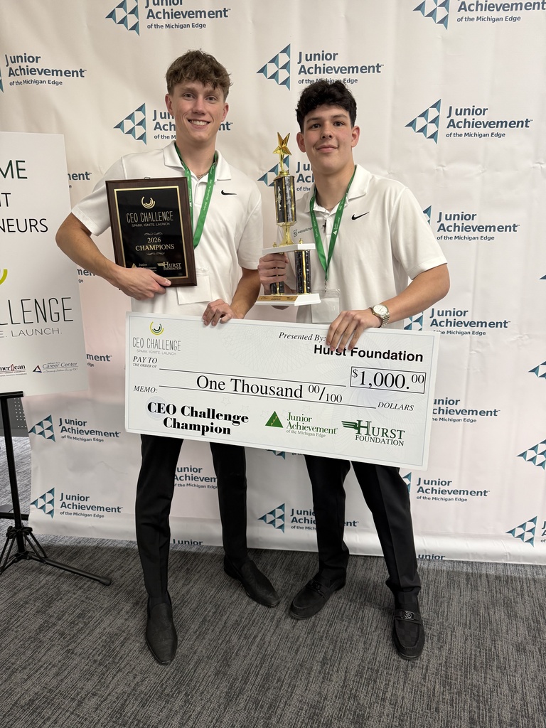 Students holding trophy
