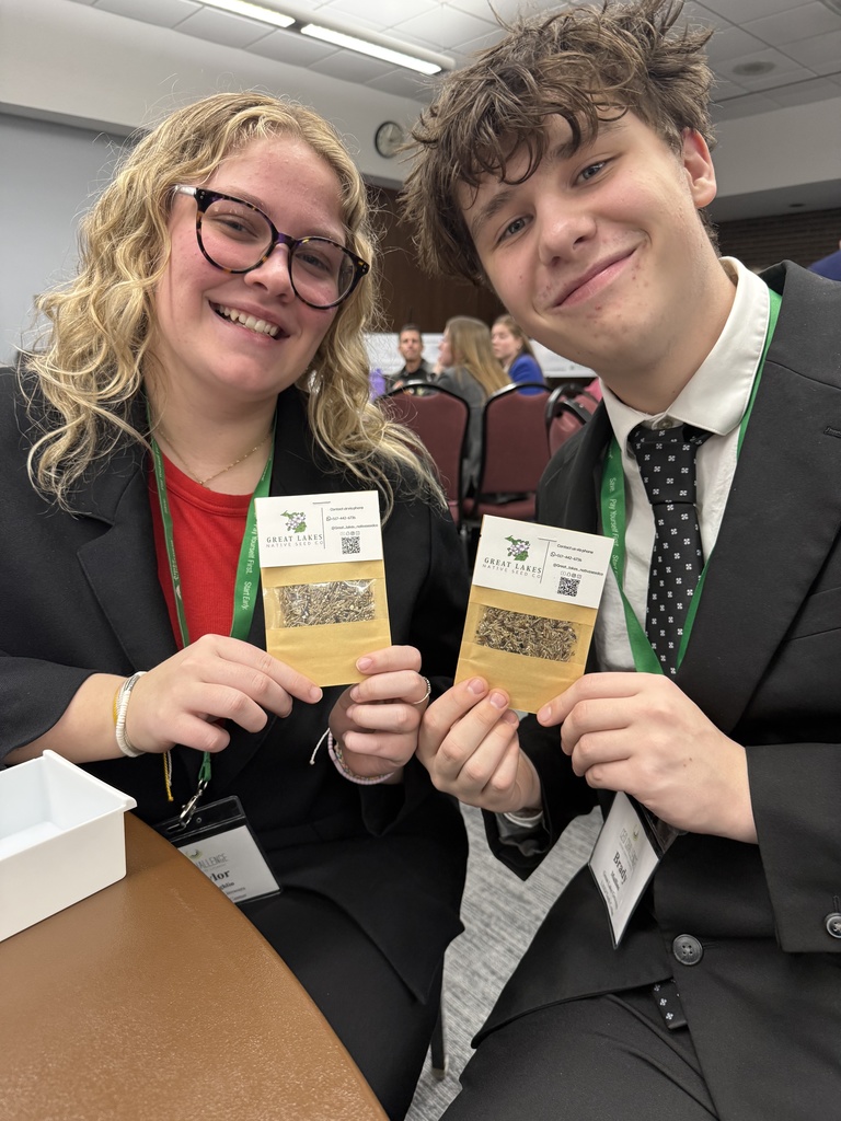 Students holding seed packets