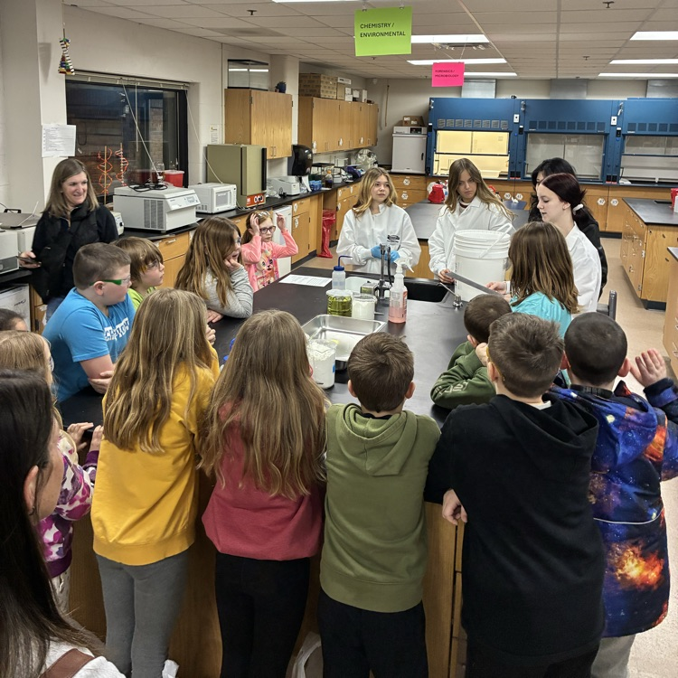 A group of students in a lab learning about bio chem