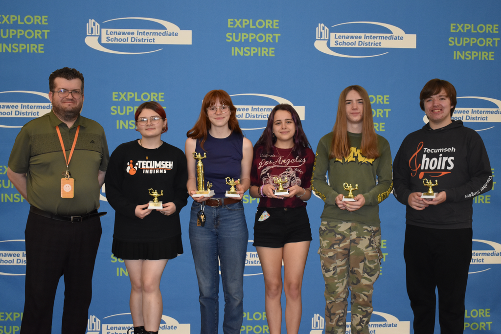 Tecumseh high School first place team posing with their trophy