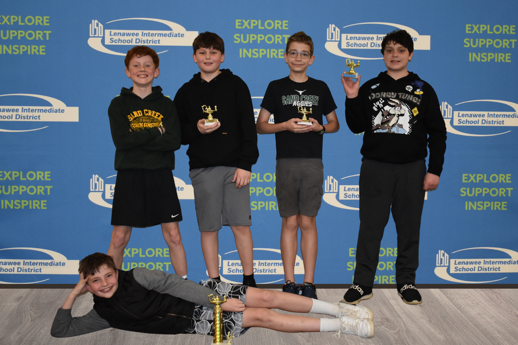 Sand Creek's first place team posing with their trophies