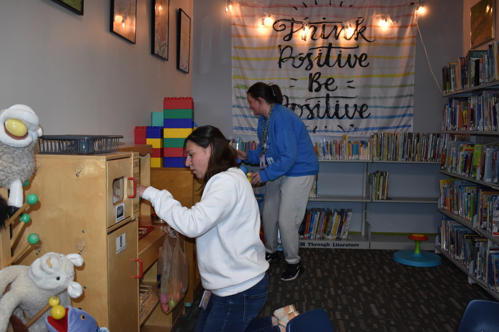 Two staff members searching for eggs
