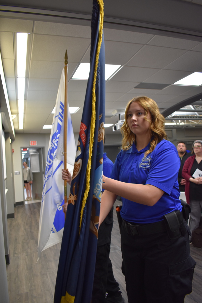 Student presenting a flag