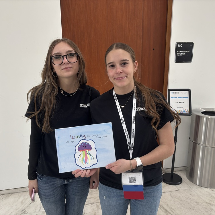 two students with their lesson for the contest