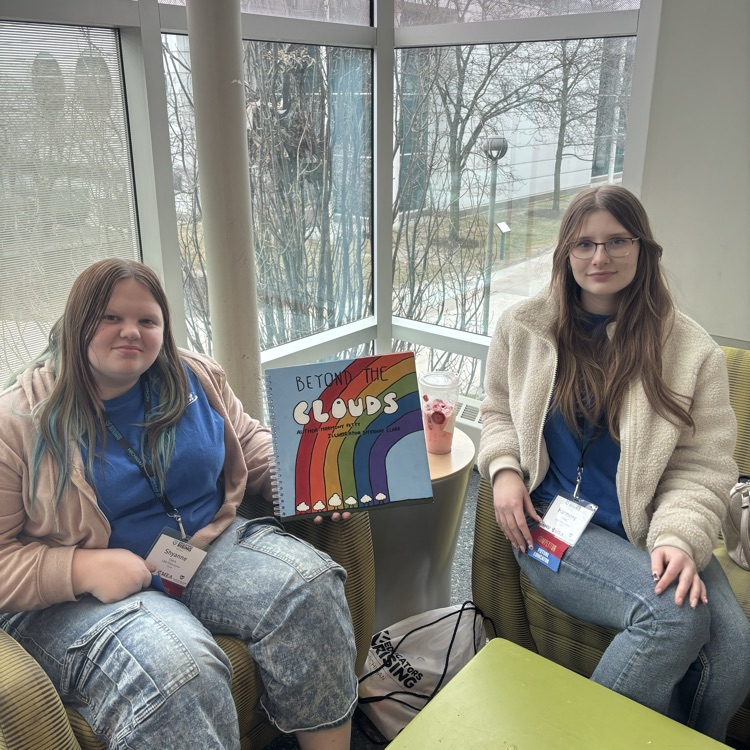 two students with their assignment 