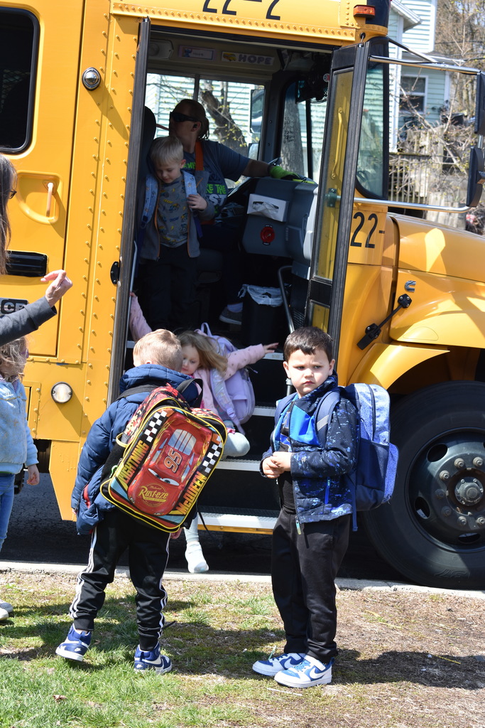 Students exiting the bus at the bowling alley