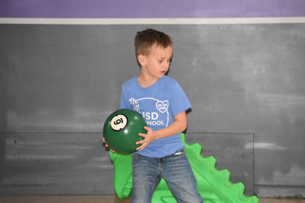 A student getting ready to release a bowling ball