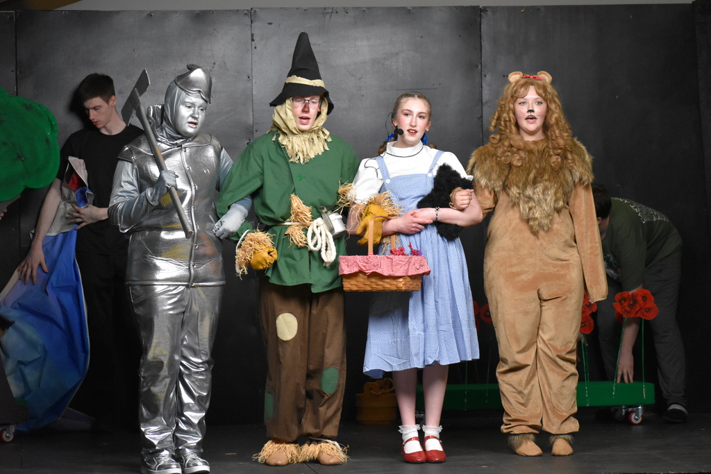 The main characters in a line singing