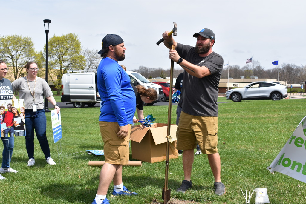 Ken and Will putting the pole in the ground