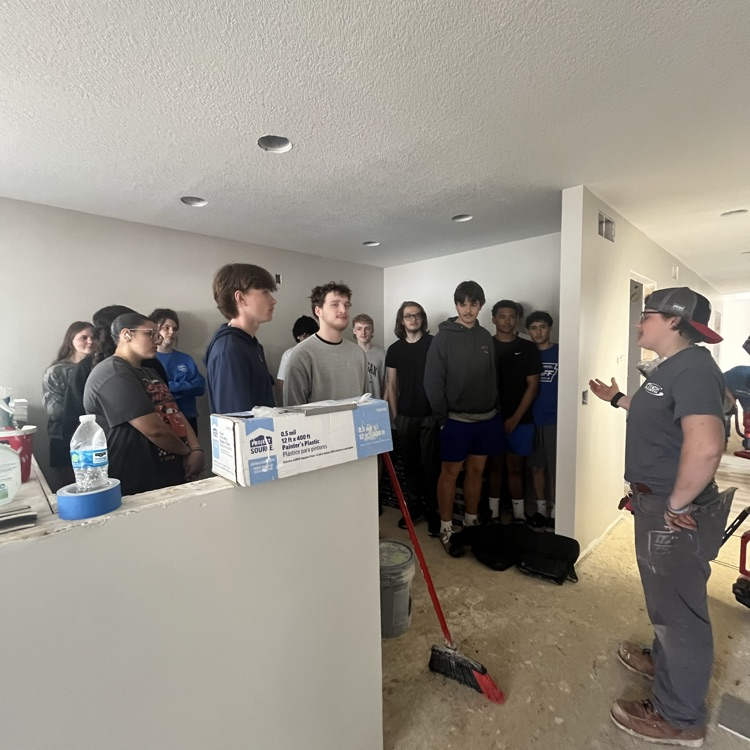Ellie Loar explaining the house build  