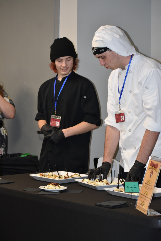 A team organizing the food items on their table
