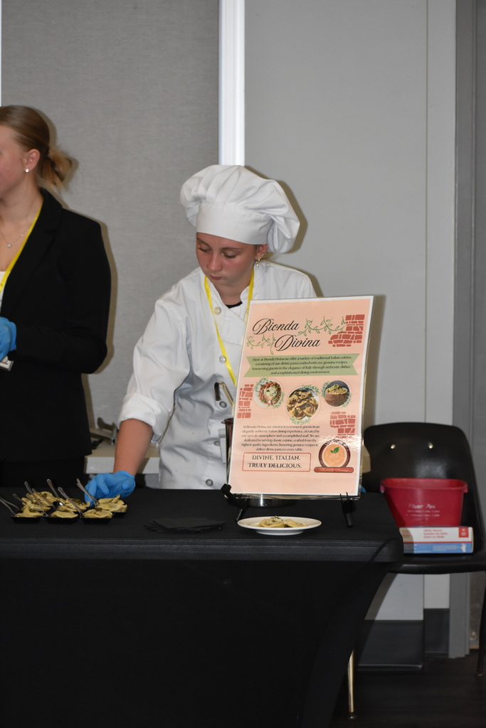 A student carefully laying out the food items