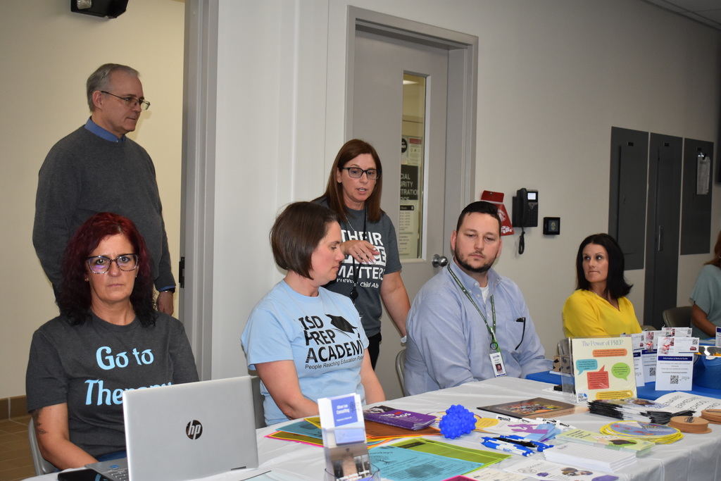 LISD staff members at a table speaking