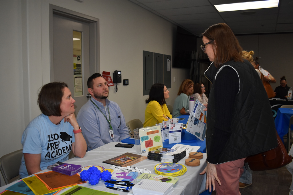 An educator speaking with LISD employees about PREP Academy
