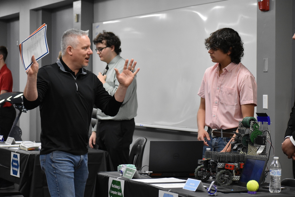 A student listening to an employer