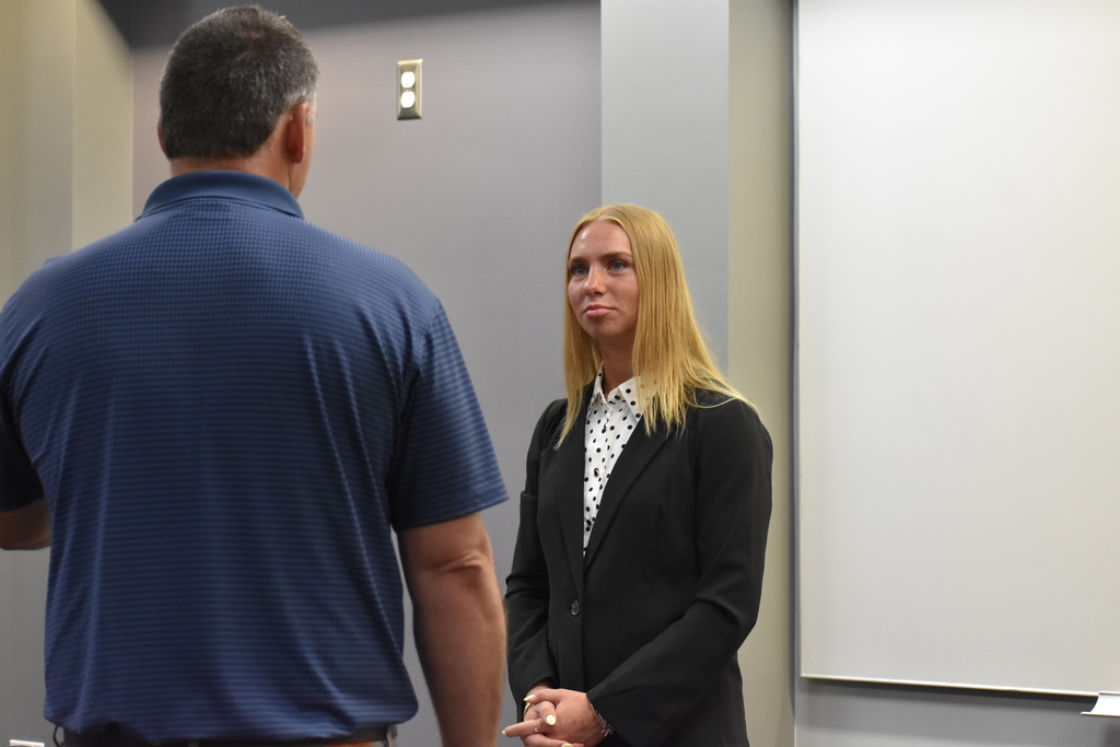 A student speaking to an employer