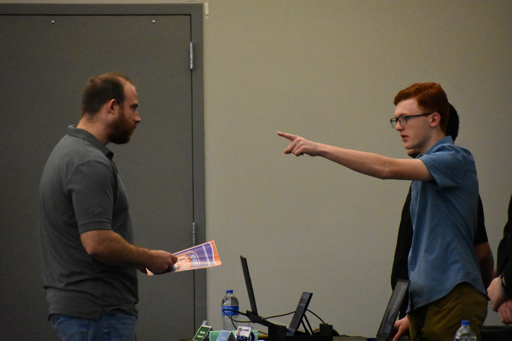a student explaining something to an employer