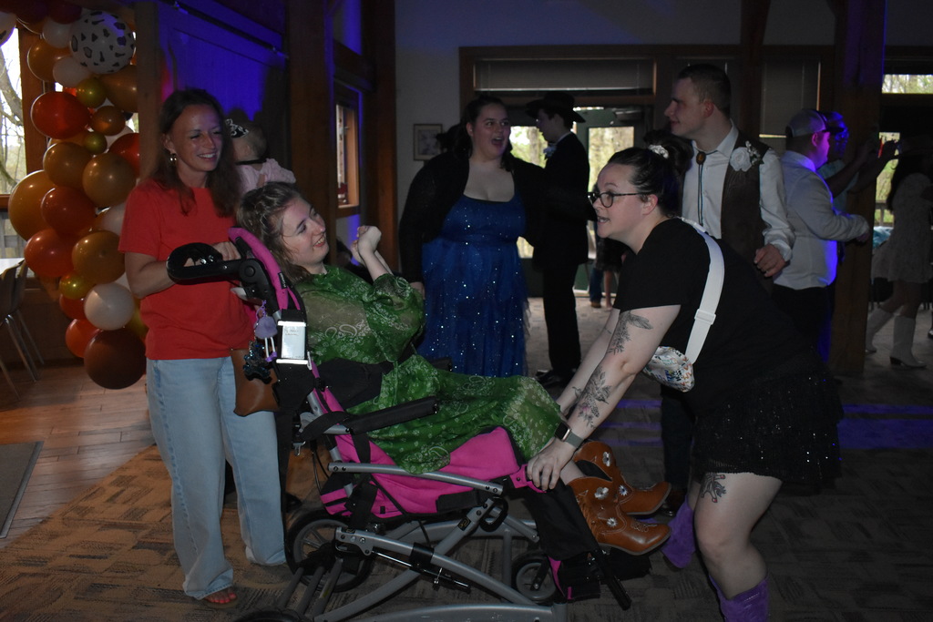 A student and guests dancing