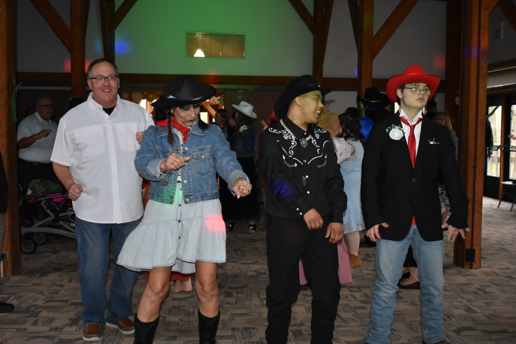 Students and teachers dancing