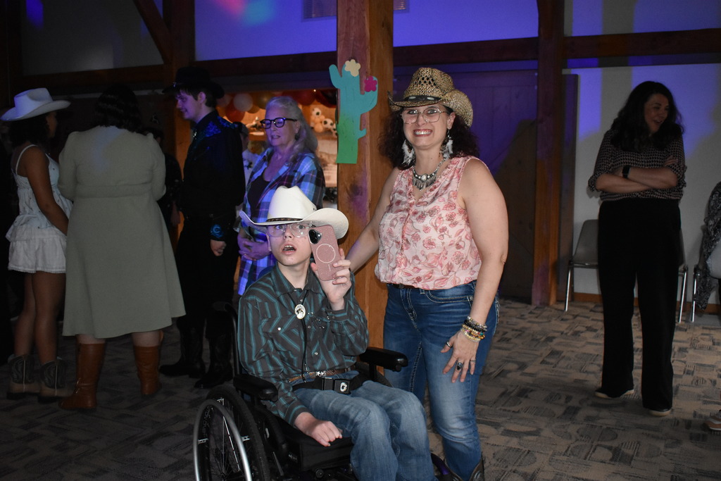 A student and chaperone dancing