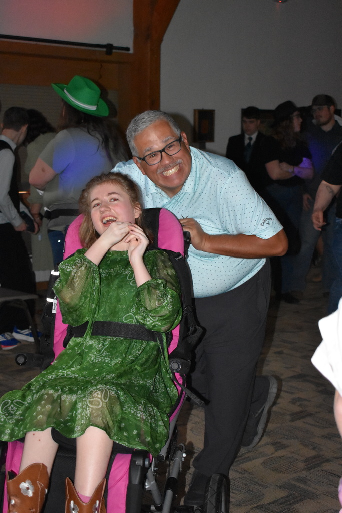 A teacher and student dancing