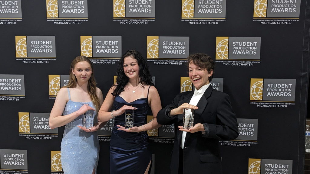 Three students posing with their awards at the NATAS Awards
