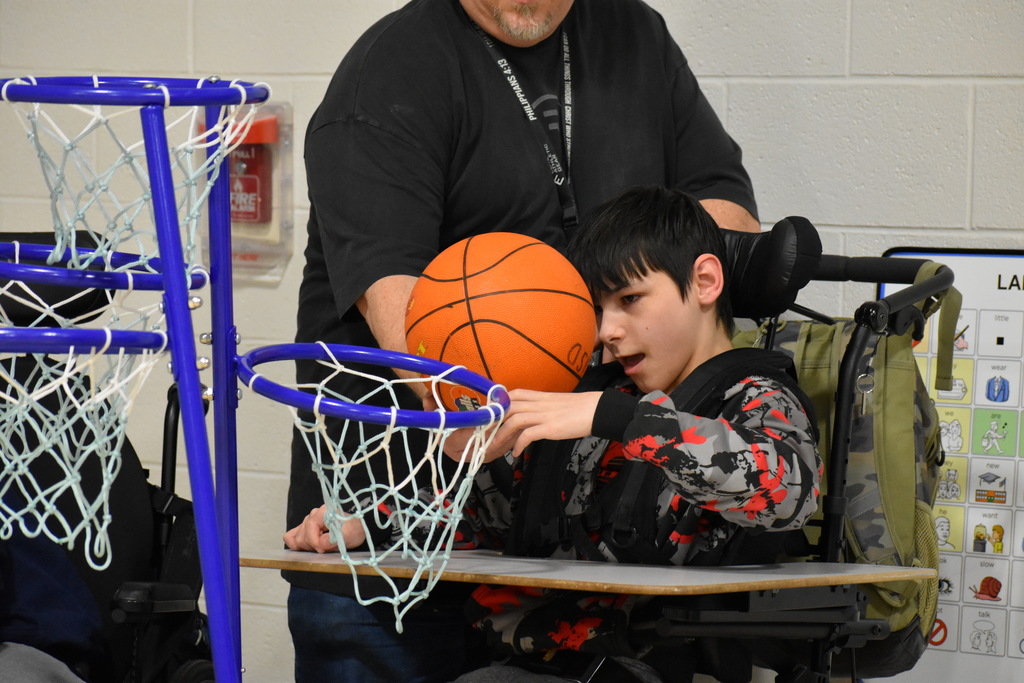 A student playing basketball