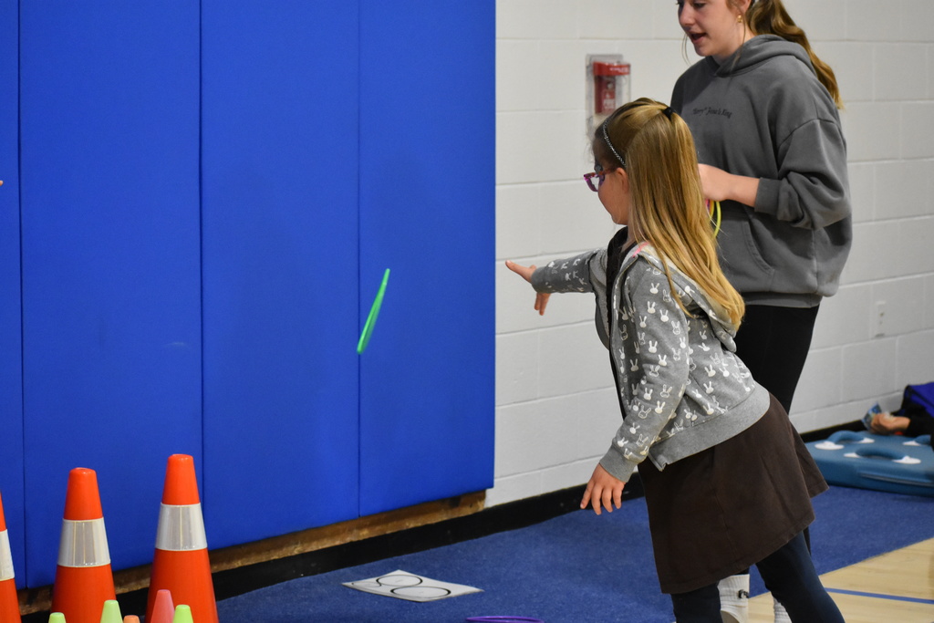 A student playing ring toss 