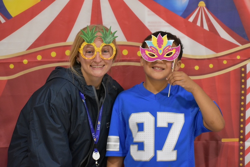 A student and a teacher in a photo booth 