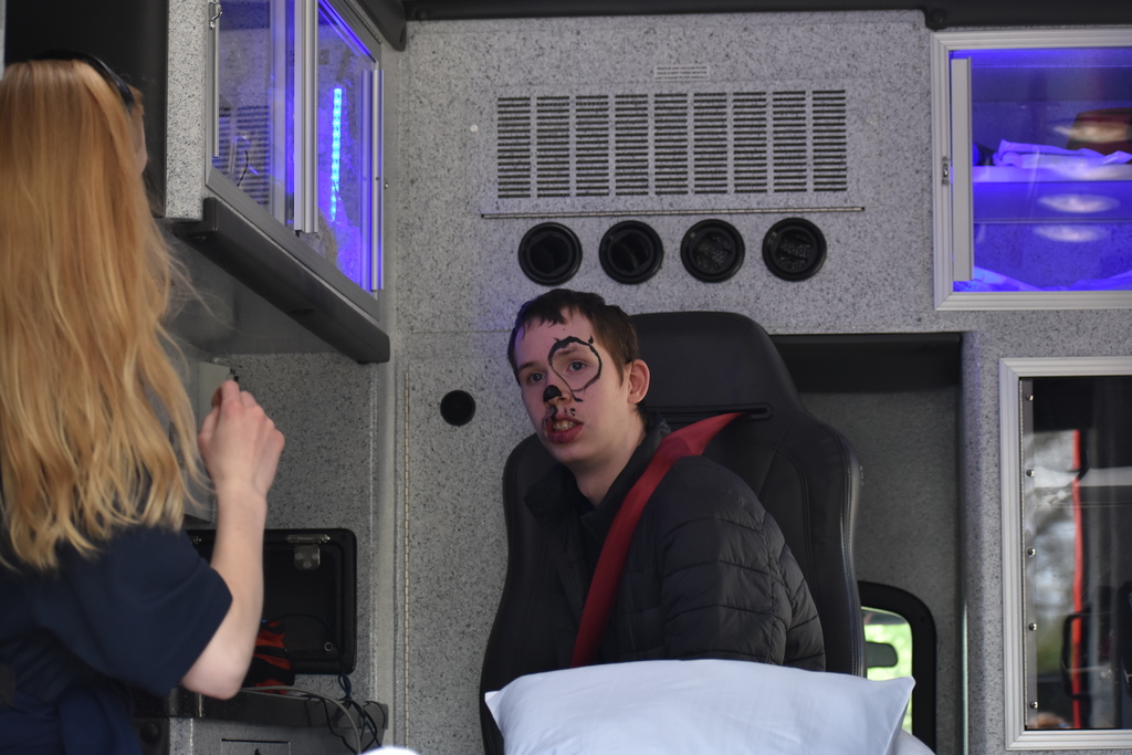 A student in the ambulance with a Raisin Twp employee