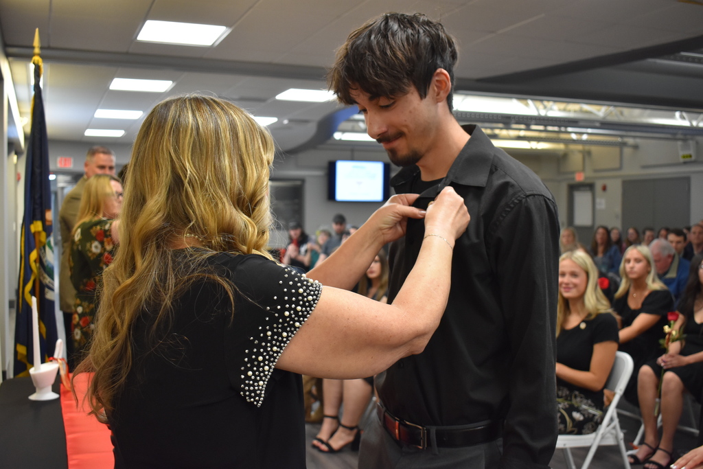 A student being pinned by their instructor