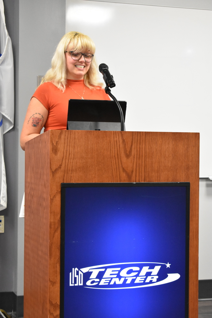 The guest speaker, who is a former student