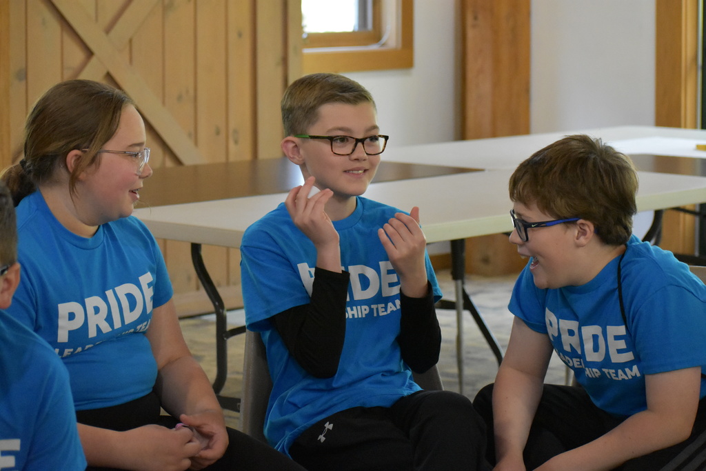 Three student group sharing together