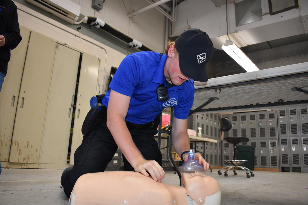 A student giving CPR