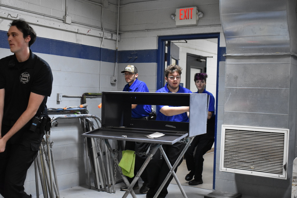Student officers running into a room 
