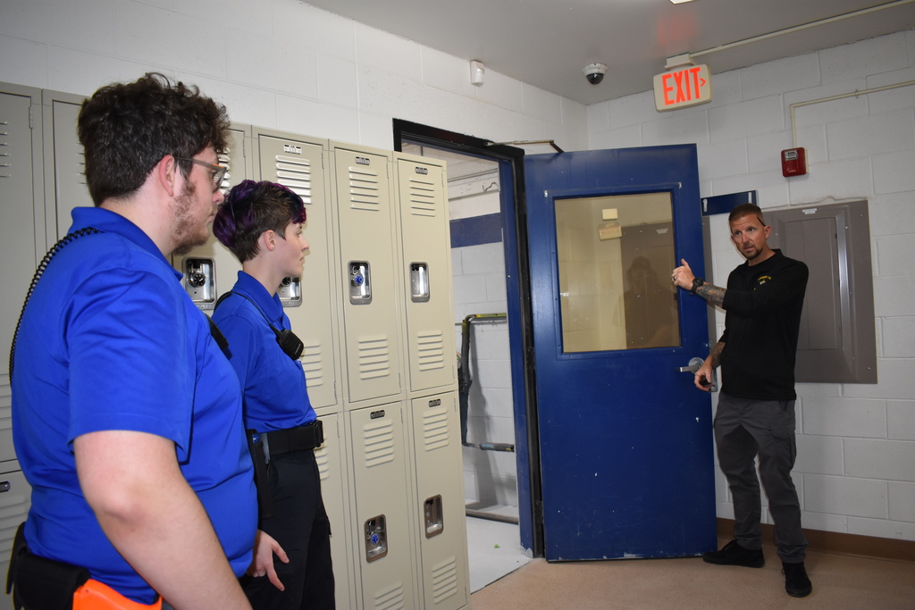 A police officer giving instructions to student officers