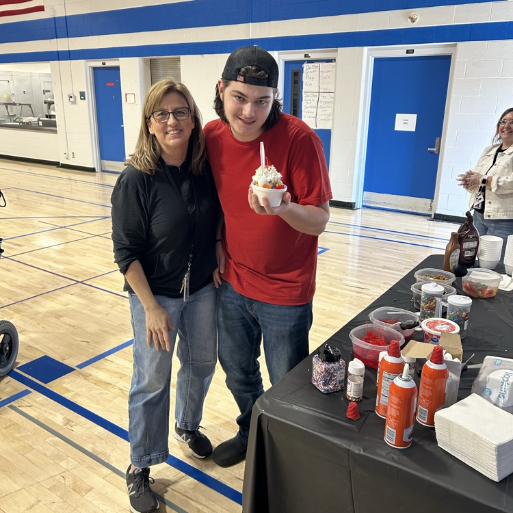 a student and staff member enjoying ice cream 