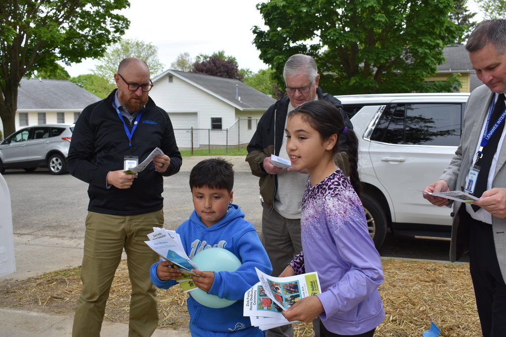 The kids of the new home passing out programs for the dedication