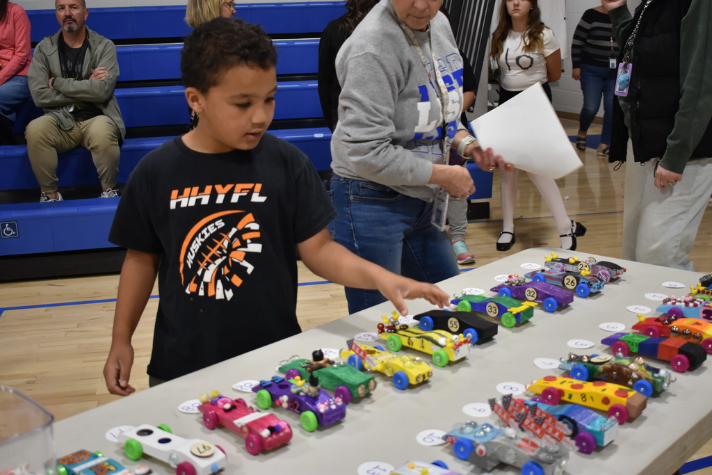 A student grabbing his car in the sea of cars