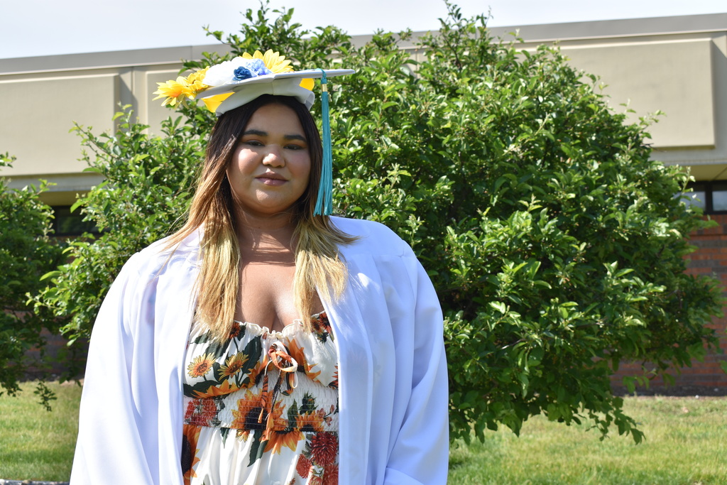 Graduate Kassie posing outside