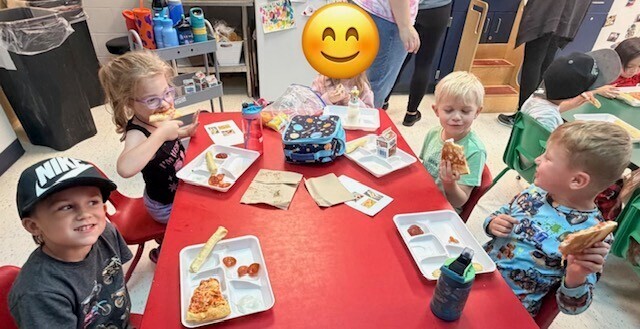 kids eating at red table