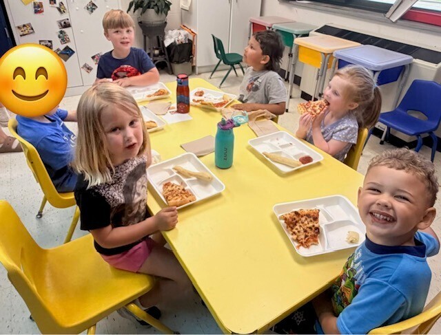 kids eating at yellow table