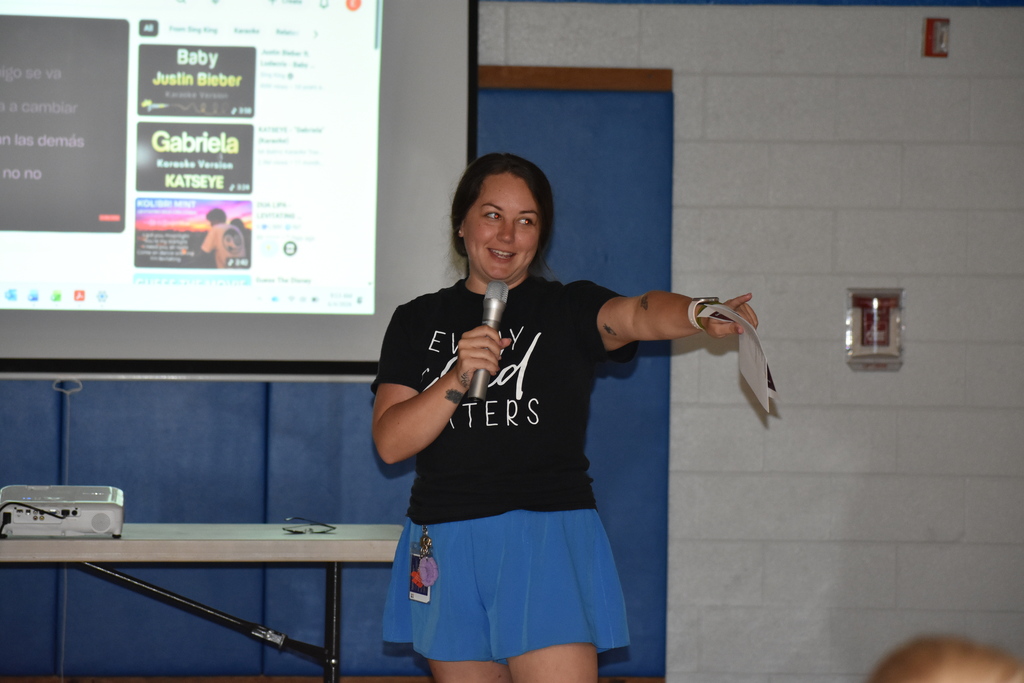 A teacher talking into the mic