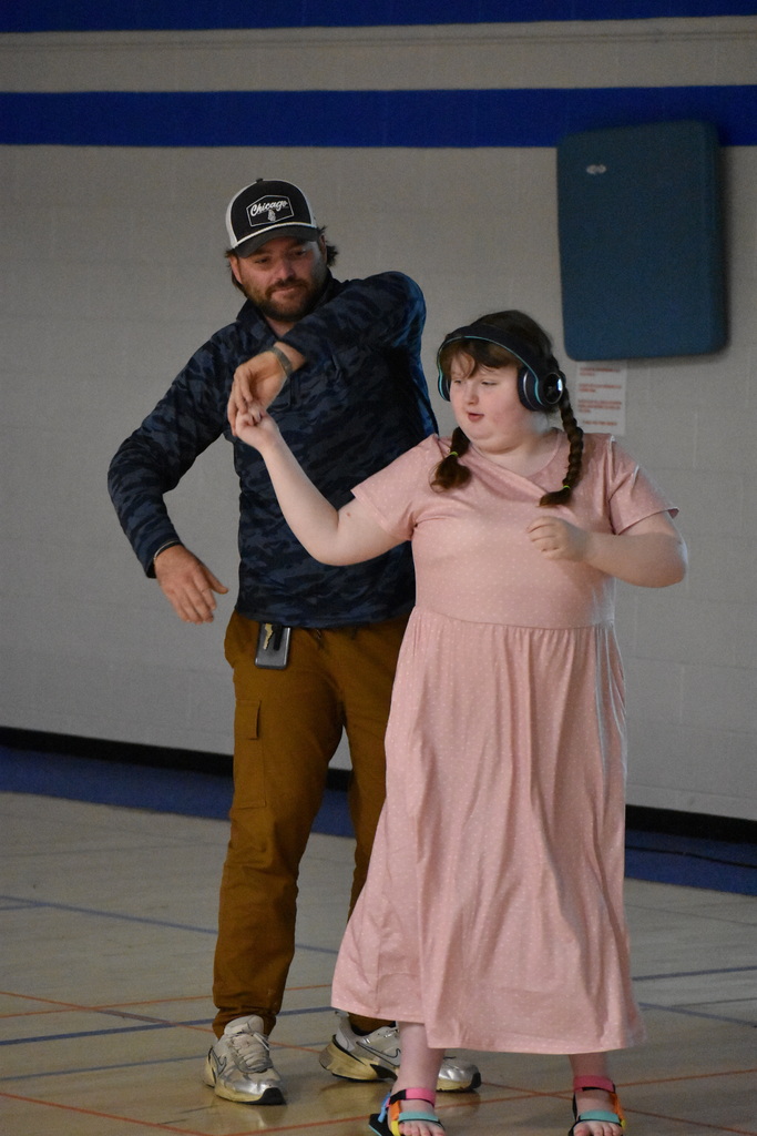 A teacher and student dancing