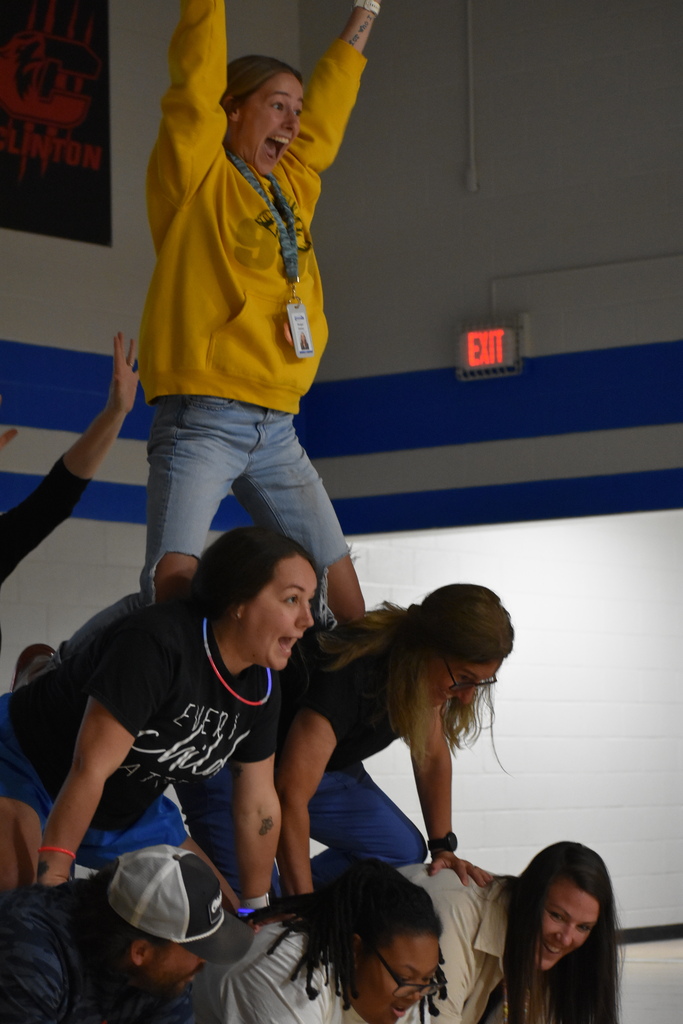 A human pyramid of staff
