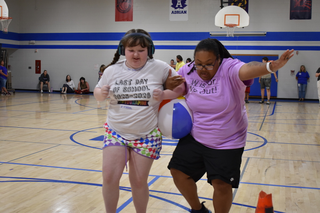 A teacher and student trying to keep a ball between them at Porter